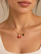 DIJE DE MARIQUITA CON CORAZÓN NEGRO