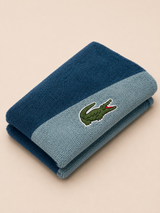 TOALLA LACOSTE AZUL BICOLOR